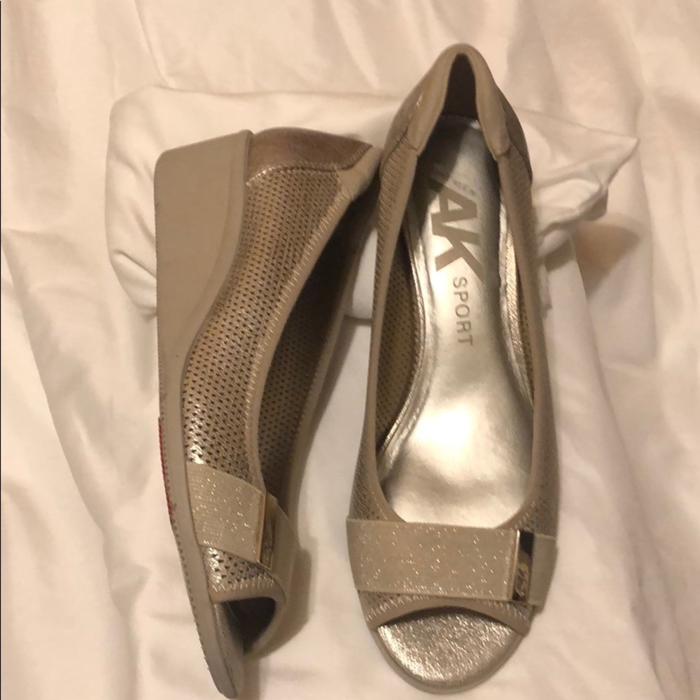 beige and gold anne Klein sports open toe shoes.
